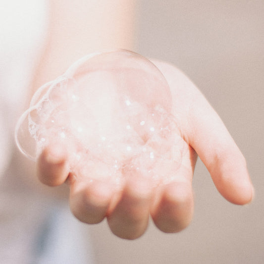 hand with bubbles on it.